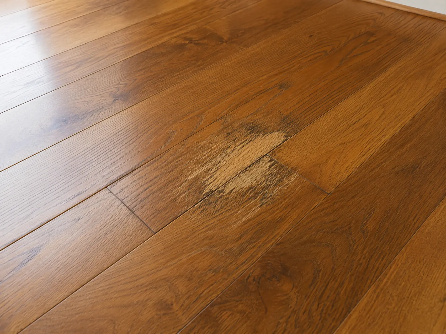 Single water-stained board in an otherwise sound oak floor — a localized repair