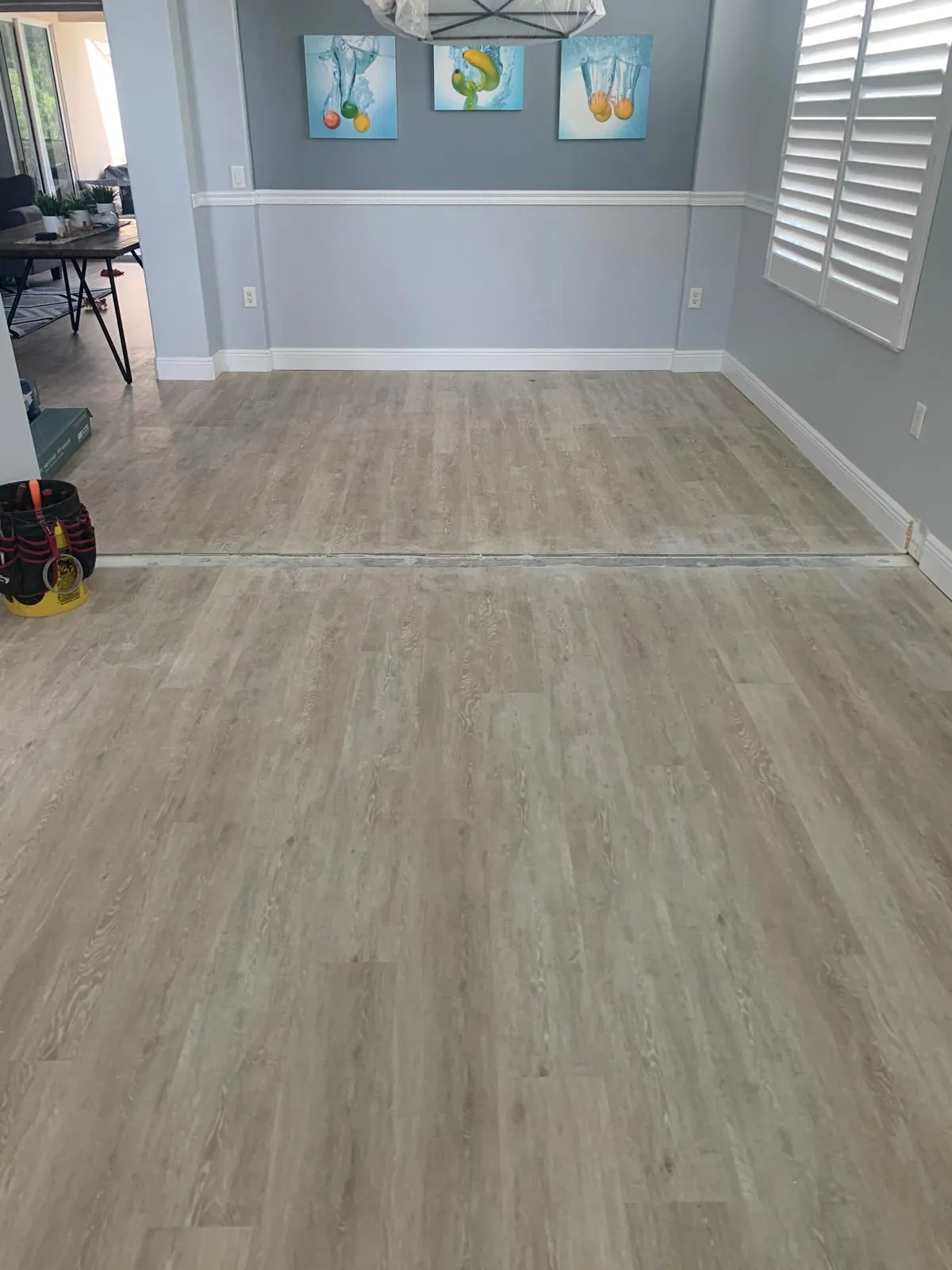New plank floor meeting a doorway threshold with a clean transition in a Sarasota dining room
