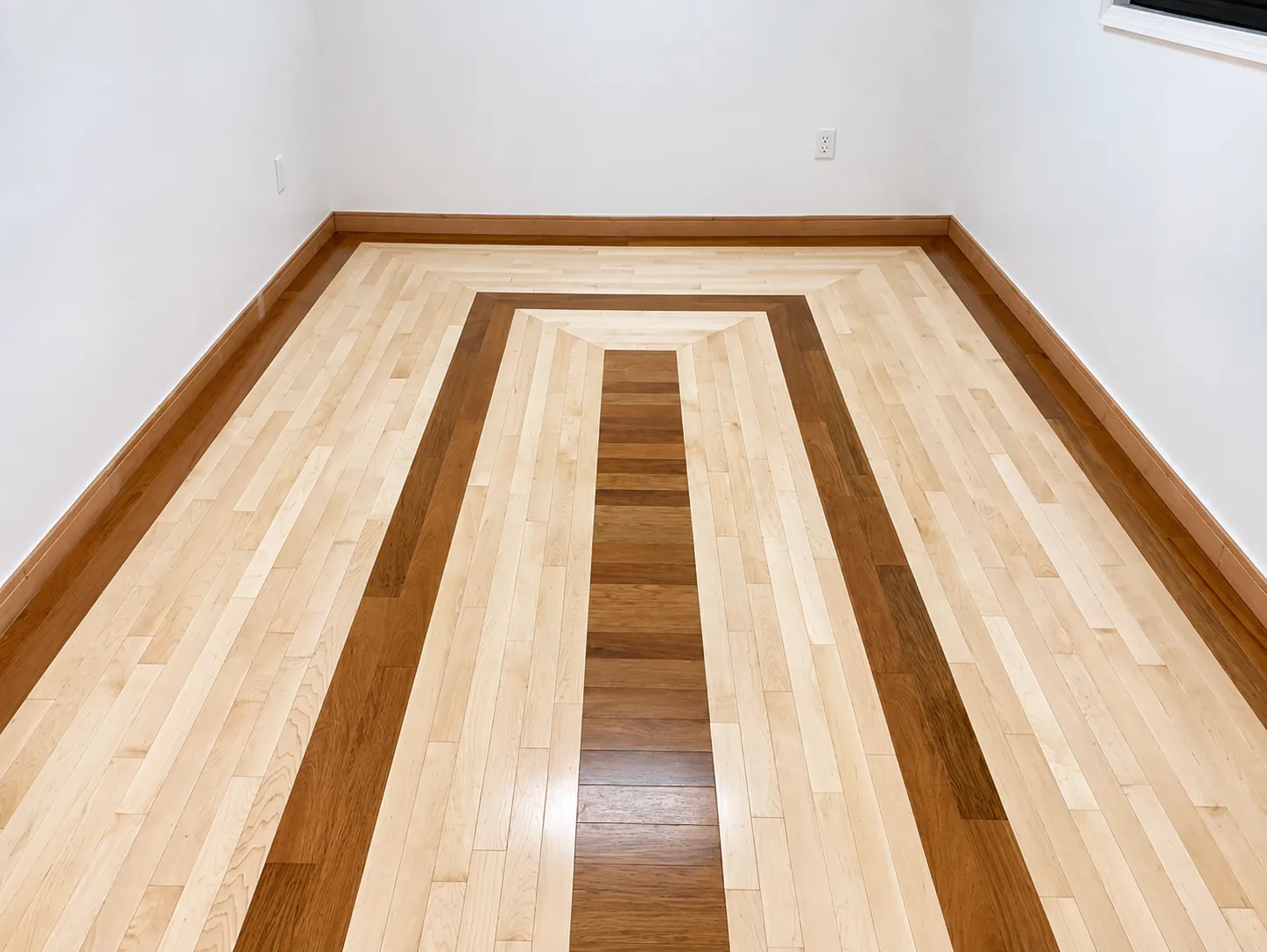 Maple floor with contrasting wood border, sanded and refinished by EGR Wood Floors in Sarasota