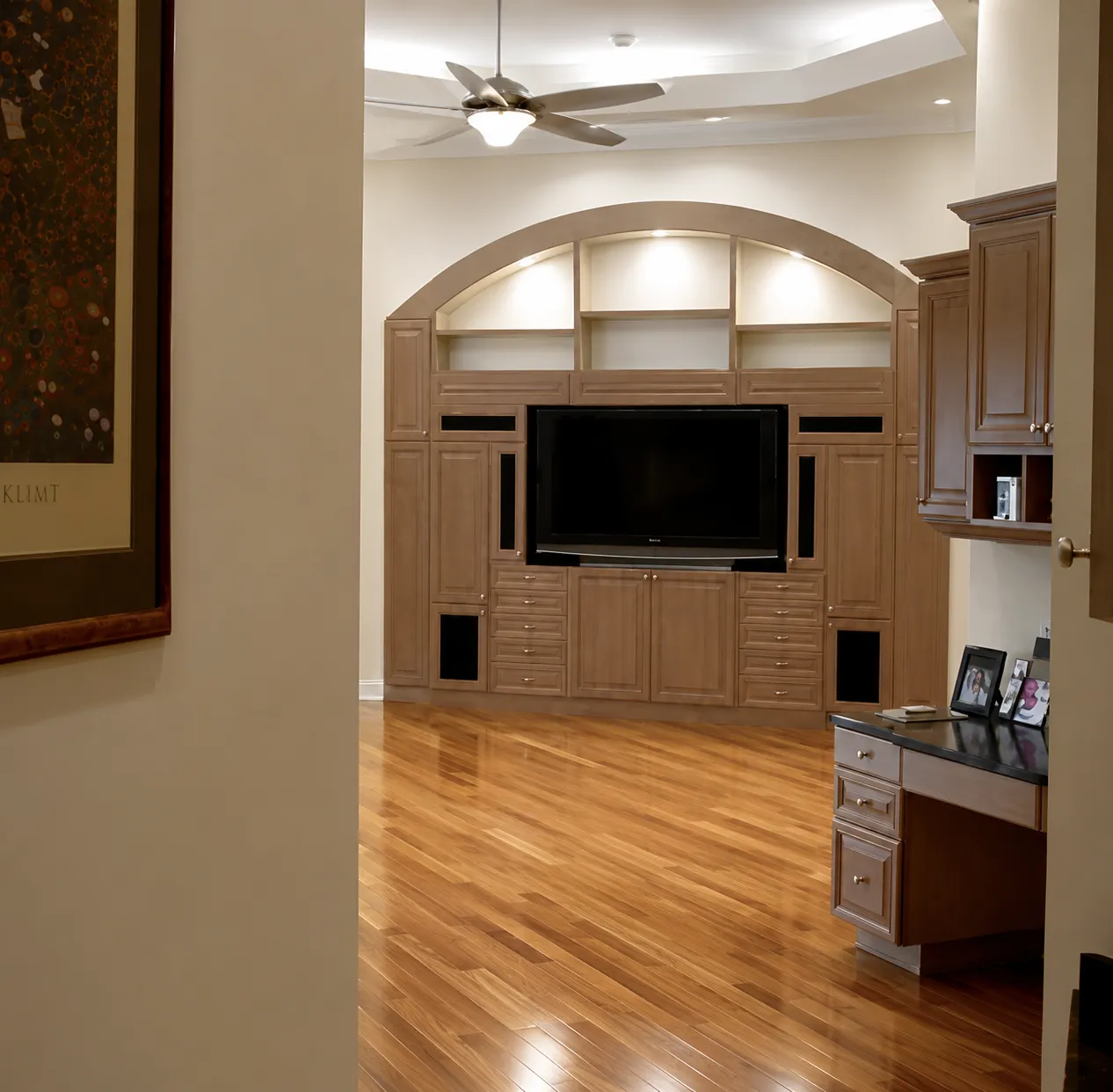 Warm maple hardwood floor in a Sarasota dining room with custom cabinetry